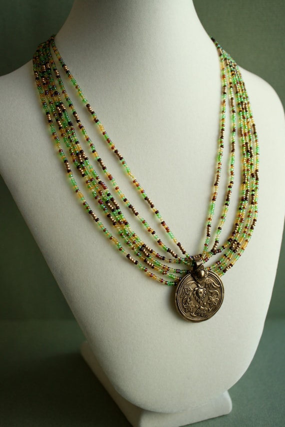 Multi Strand Seed Bead Necklace with Brass Medallion