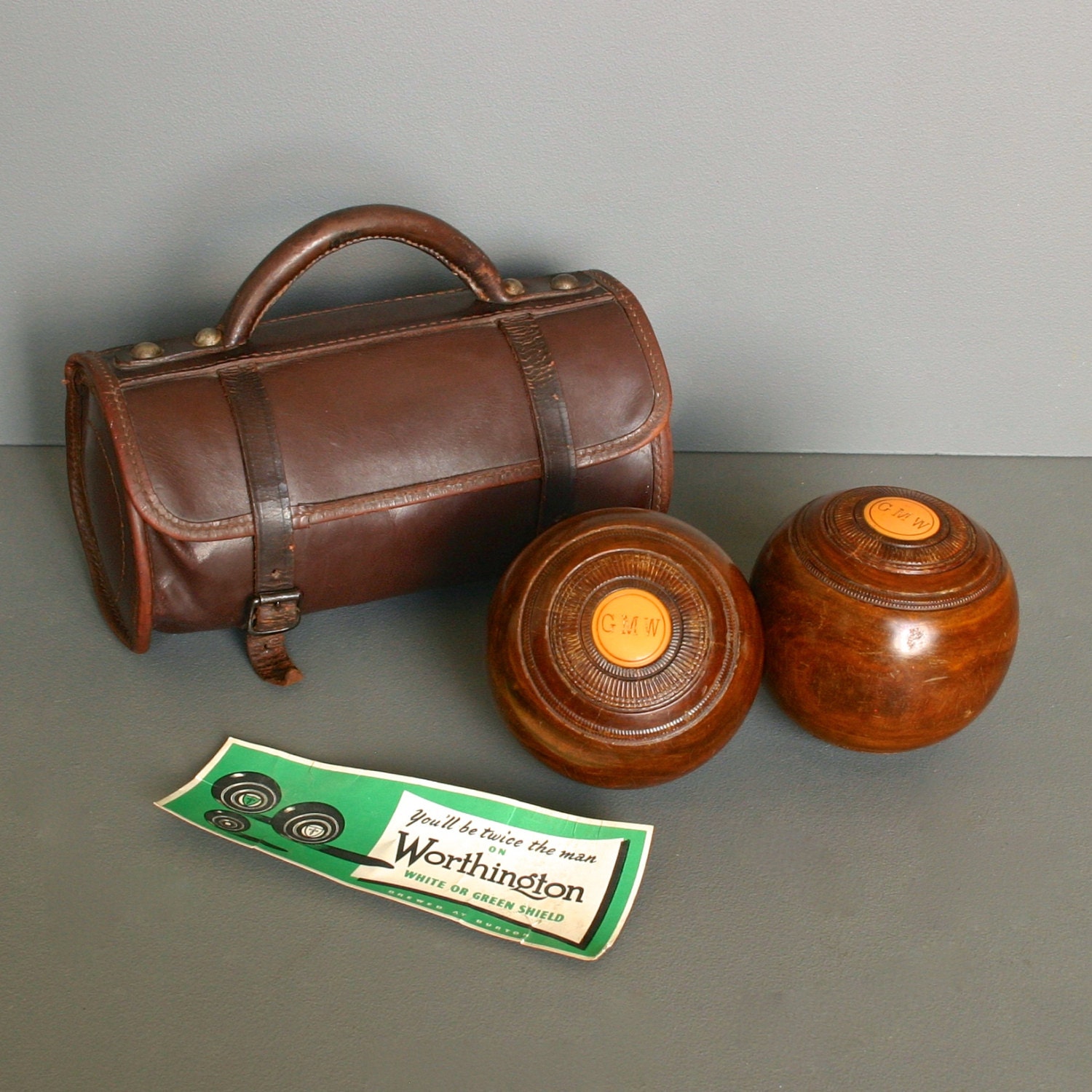 Pair of Vintage Lawn Bowls from England with original Leather