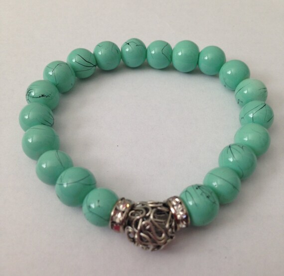 Turquoise glass bead bracelet with silver string bead and