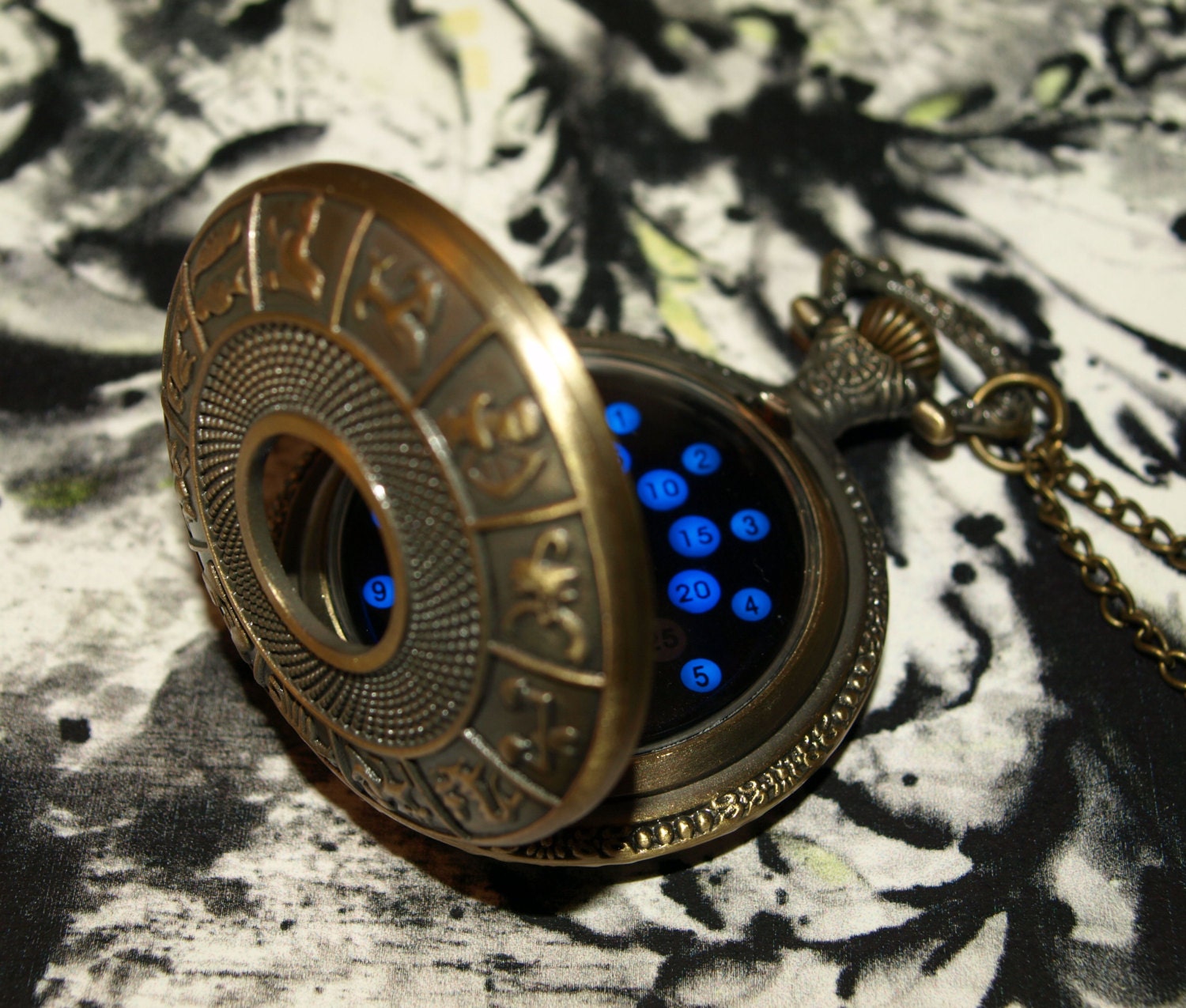 Bronze zodiac LED pocket watch with blue display. Classic fob