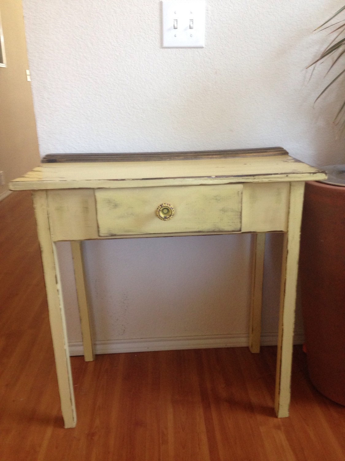 Antique vanity / side table in distressed yellow with faux drawer
