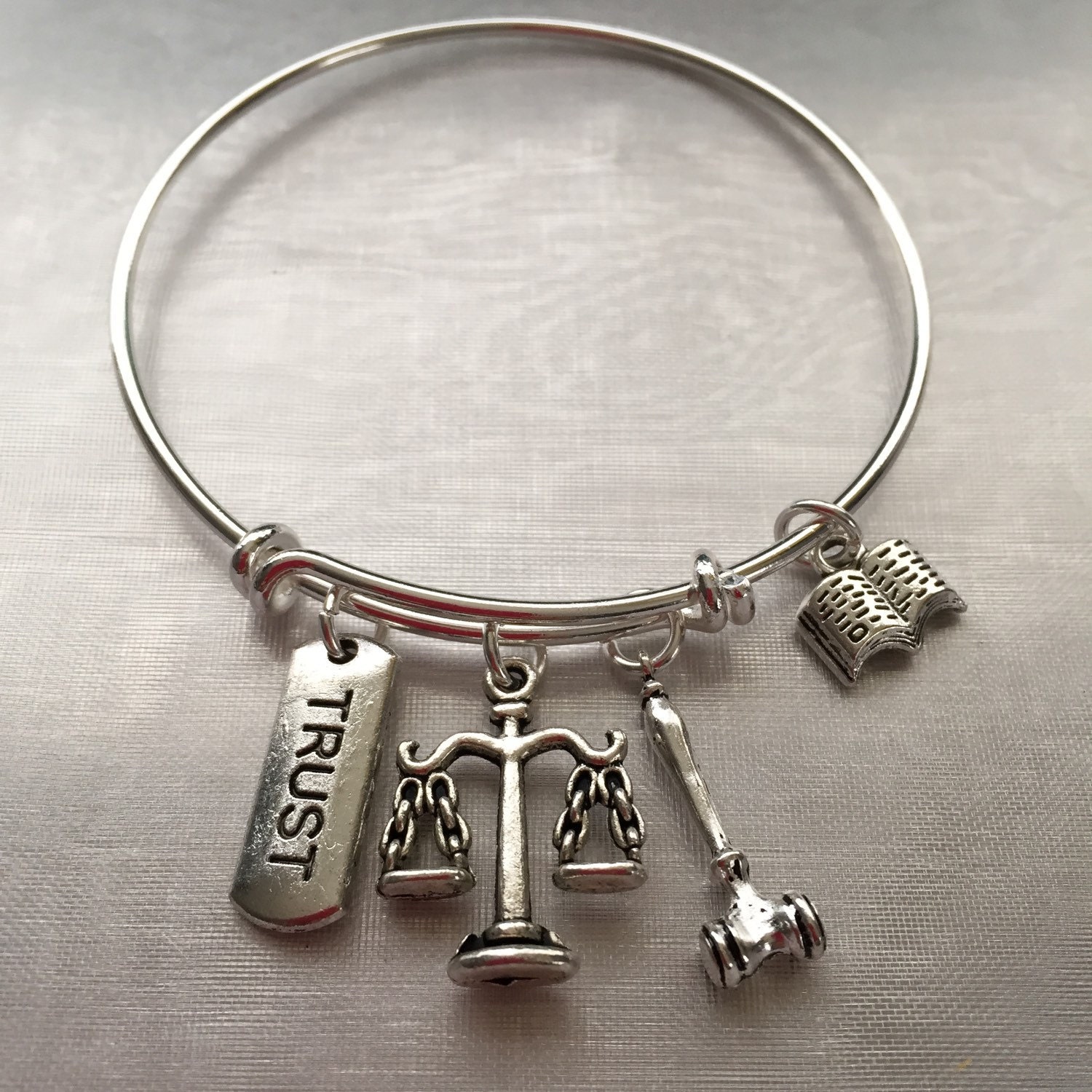 LawyerBracelet with stamped trust book gavel and scale charms