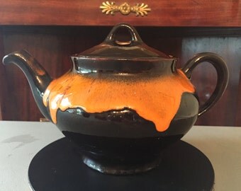 Royal Canadian Art Pottery "dripless" teapot with orange drip decoration