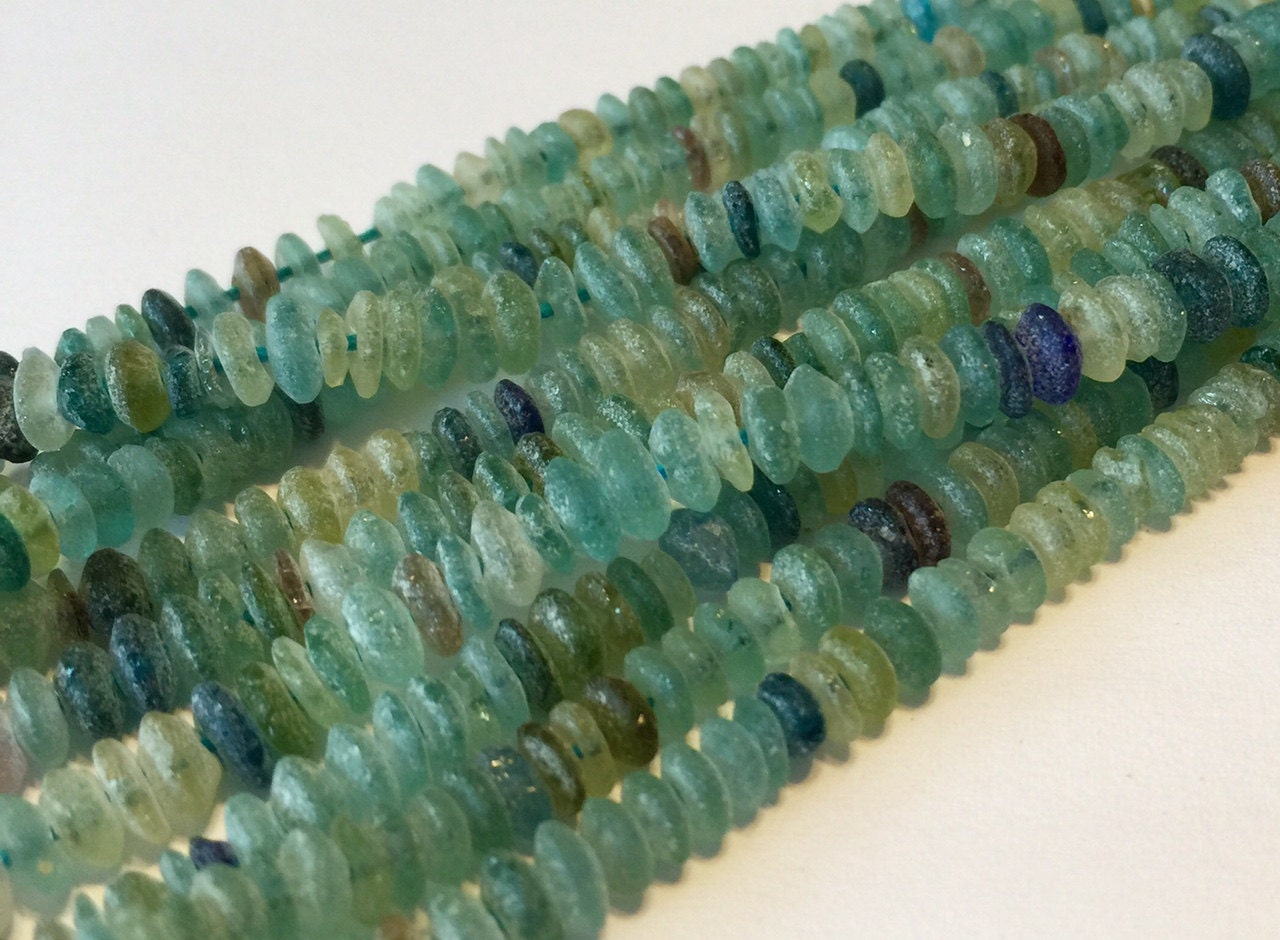 Ancient roman glass beads little rondelles saucers