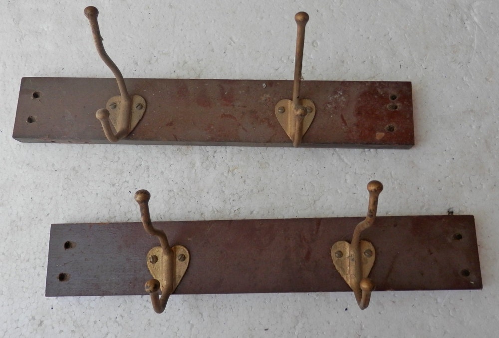 set of 4 matching vintage hall tree hooks with screws mounted on 2 boards. Haute Juice