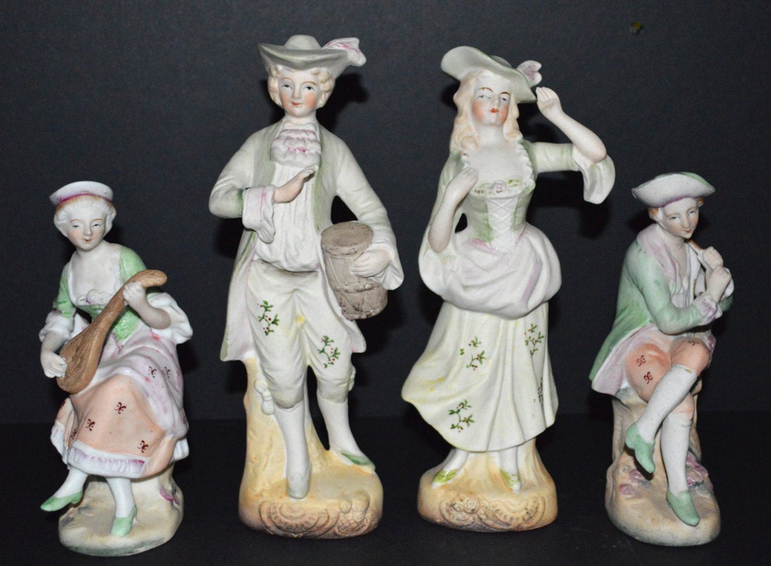 antique colonial figurines