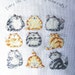 Every Life Should Have Nine Cats - a cross stitch picture.