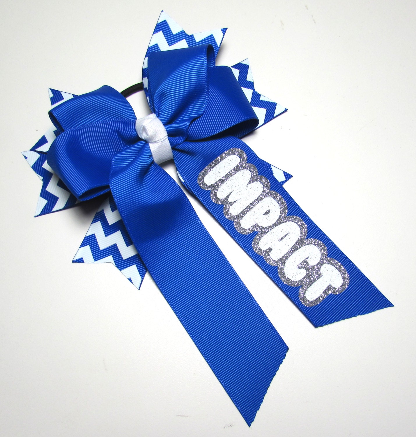 Cheer hair bowlong tail with white and royal blue chevron Cheer hair bowlong tail with white and royal blue chevron