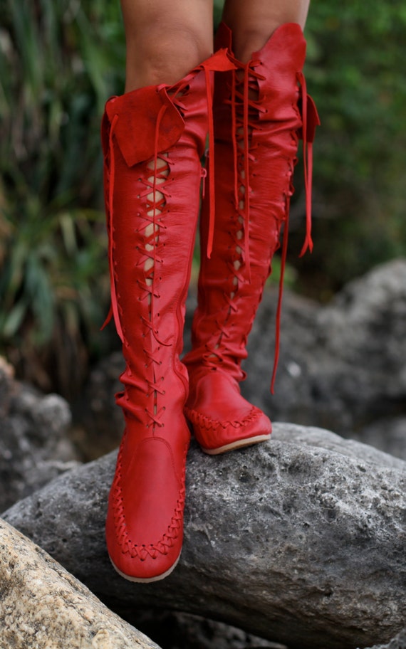 Handmade red leather lace up boots for women.