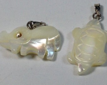 2 Charms, 1 elephant, 1 turtle, in white shell. 25 mm.