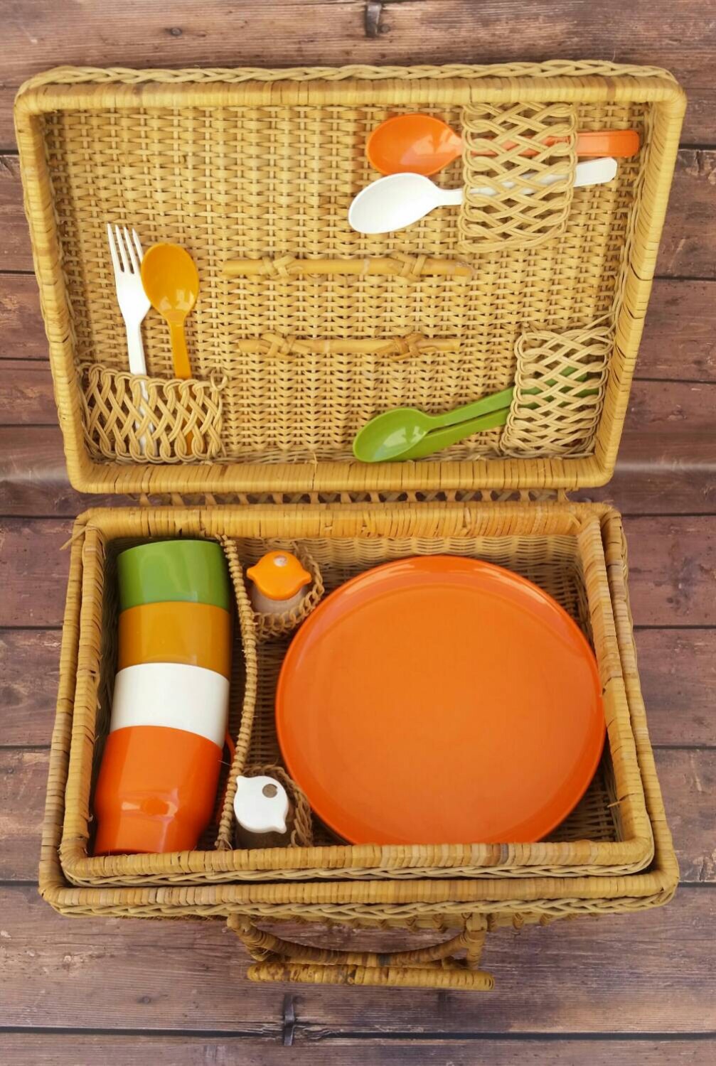 Large vintage wicker picnic basket with cups, plates, utensils, salt