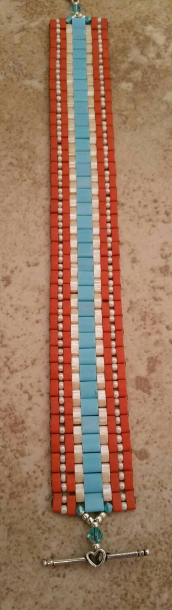 REDUCED!! Bead broke. Repaired Turquoise and beige