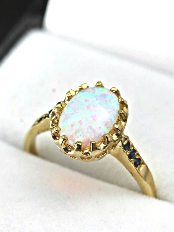 Opal and sapphire engagement ring in 9 carat by aardvarkjewellery