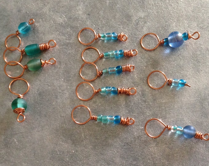 copper, blue and green stitch markers