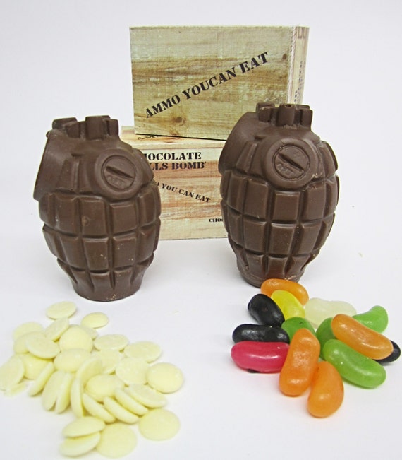 Two milk chocolate hand grenades with white buttons and jelly