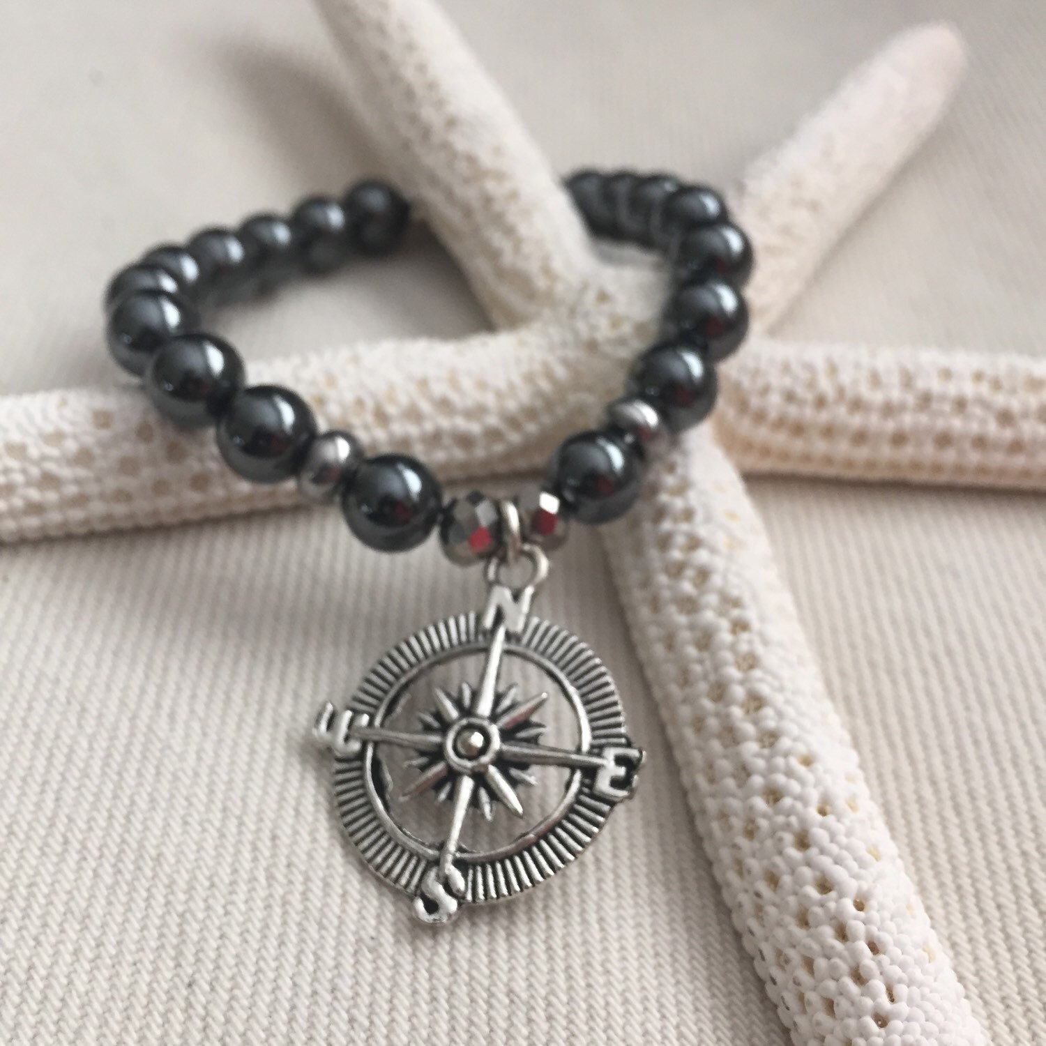 Compass charm bracelet on glass metalic beads. by SunReys7 on Etsy