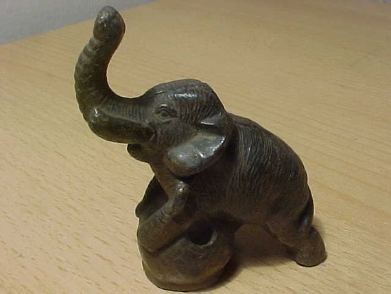 Cast Iron Trumpeting Elephant paperweight maybe on World Globe
