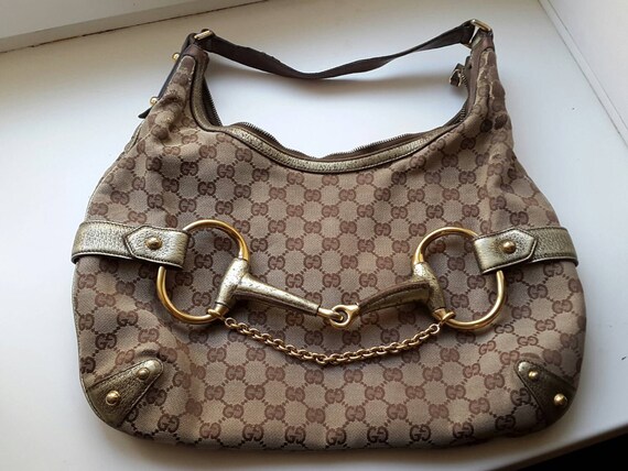 Authentic Gucci monogram bag with gold metal belt