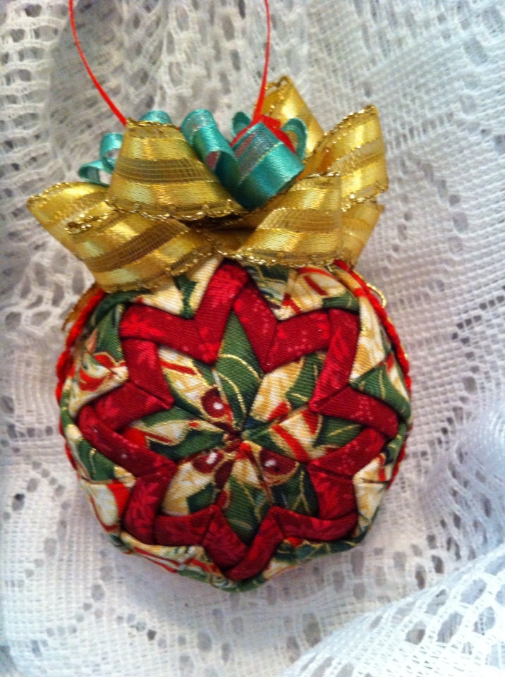 Gold and red Christmas fabric pinecone ornament. 