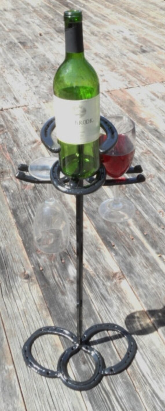 Drink Holders made from used horseshoes clean and painted.