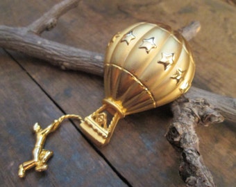 vintage gold tone ajc balloon with hanging man brooch