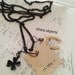 LUCKY - mens stamped tag, clover & horseshoe metalwork talisman charm and black chain NECKLACE