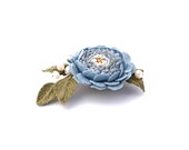 Romantic blue crocheted flower brooch with river pearls