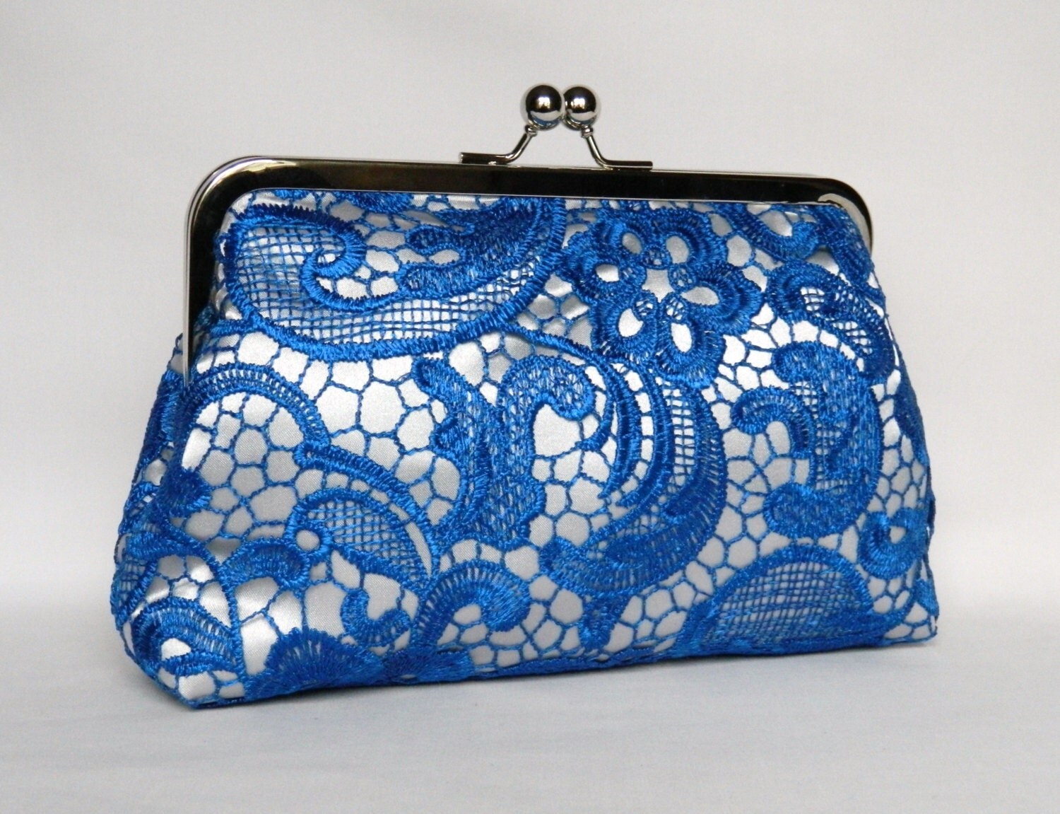 royal blue and silver clutch bag