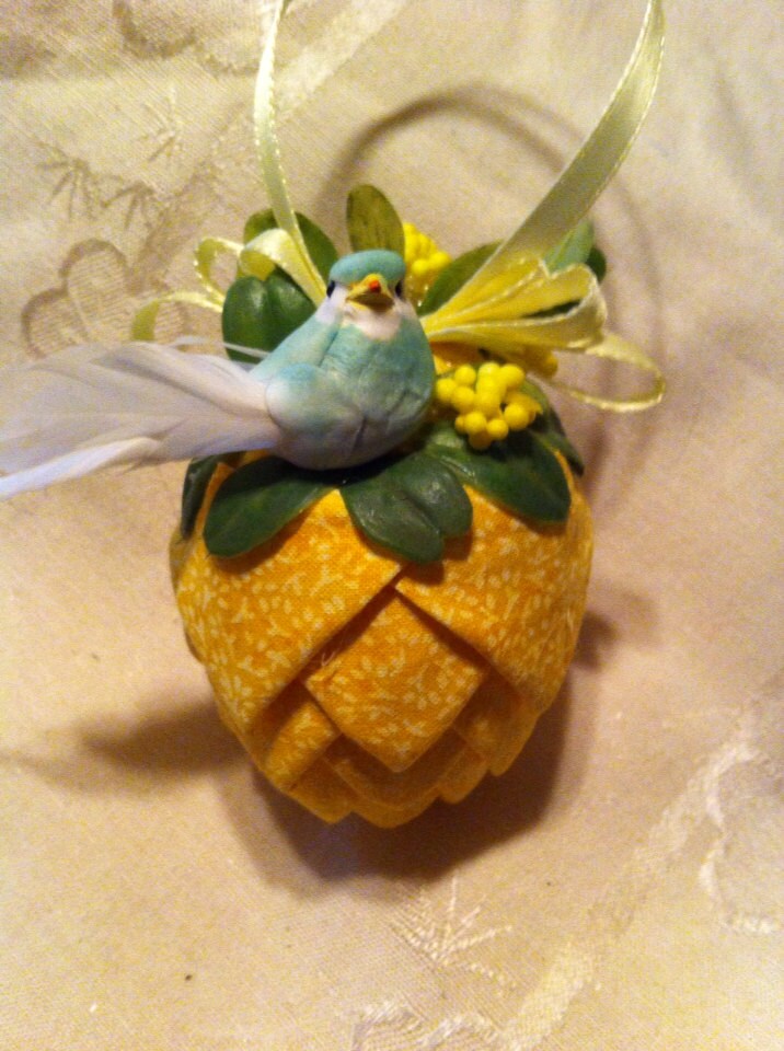 Yellow print fabric pinecone decoration. 