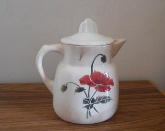 A French vintage pitcher with poppy decoration