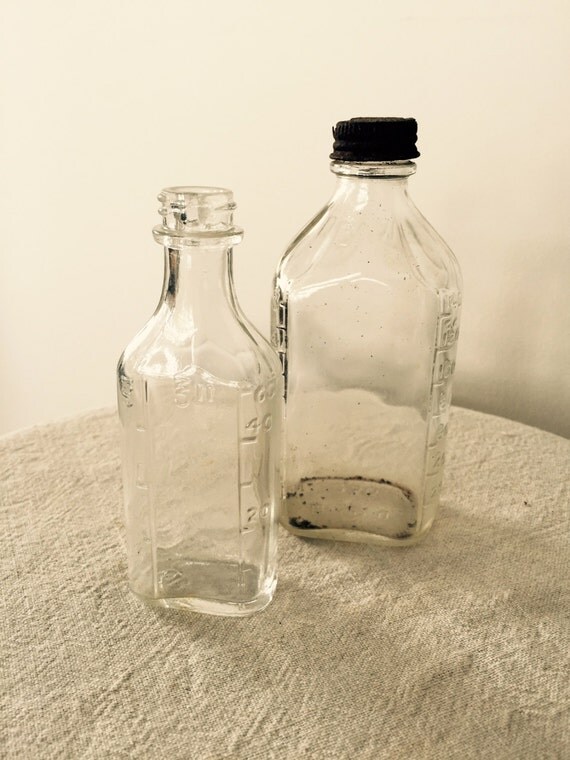 Antique Small Glass Bottles Vintage Set of Two Embossed