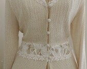 Lace trimmed covered buttons Cardigan Top with a hint of sparkle.  Long sleeve w/slimming fit