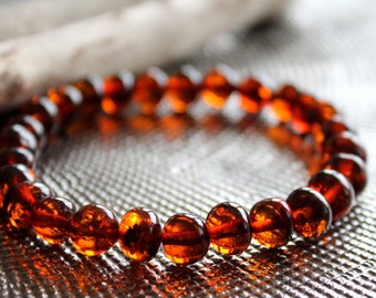 Baltic amber bracelet, Natural amber, Stretchy bracelet, Handmade jewellery, Cognac color bracelet, semi – round beads, amber jewelry, gift