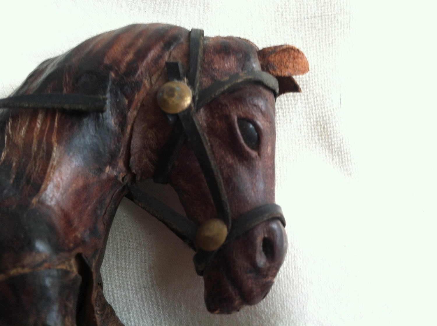 antique leather horse figurine