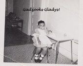 Circa Early 1960's African American Girl on Toy Phone - Black and White Photo Scanned