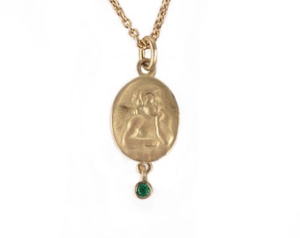 golden guardian angel with emerald, sapphire, ruby
