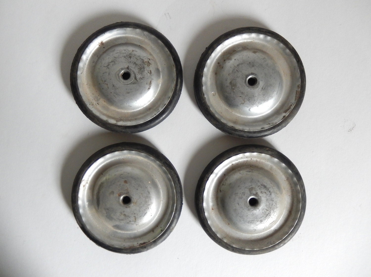 Set of 4 Antique Metal & Solid Rubber Push Toy Wheels by JoeBlake
