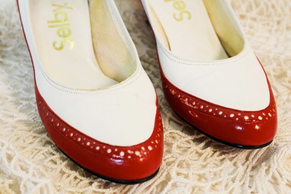 red and white spectator pumps
