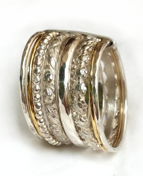 Stackable wedding  band  silver and gold 8 rings  joined  by 