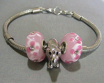 Sterling Silver Pugster Elephant, Pink Flowered Rhinestone Lampwork Charms on a double alligator clasp Silver Pugster Bracelet