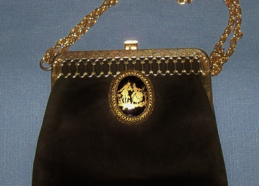 small black and gold purse