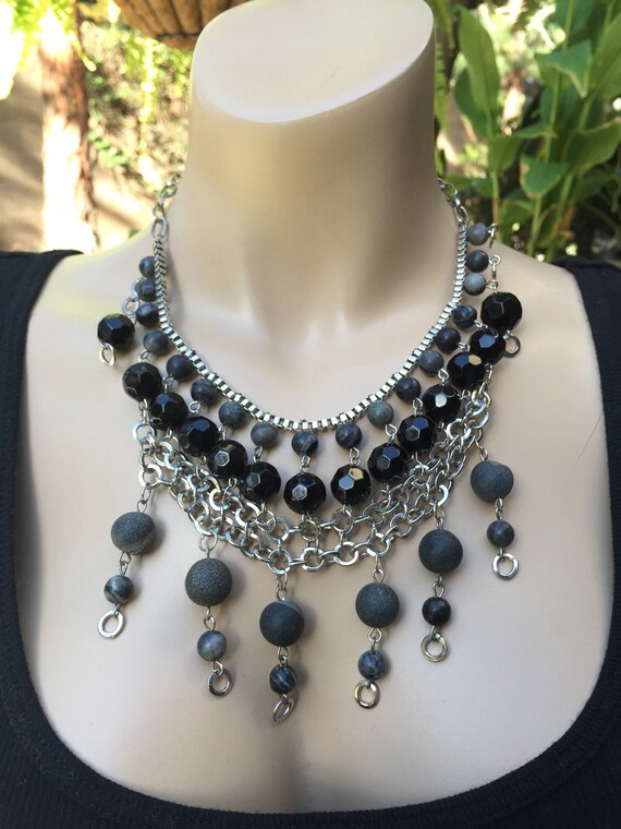 Items similar to Black Bib necklace made with gemstones and crystal on Etsy