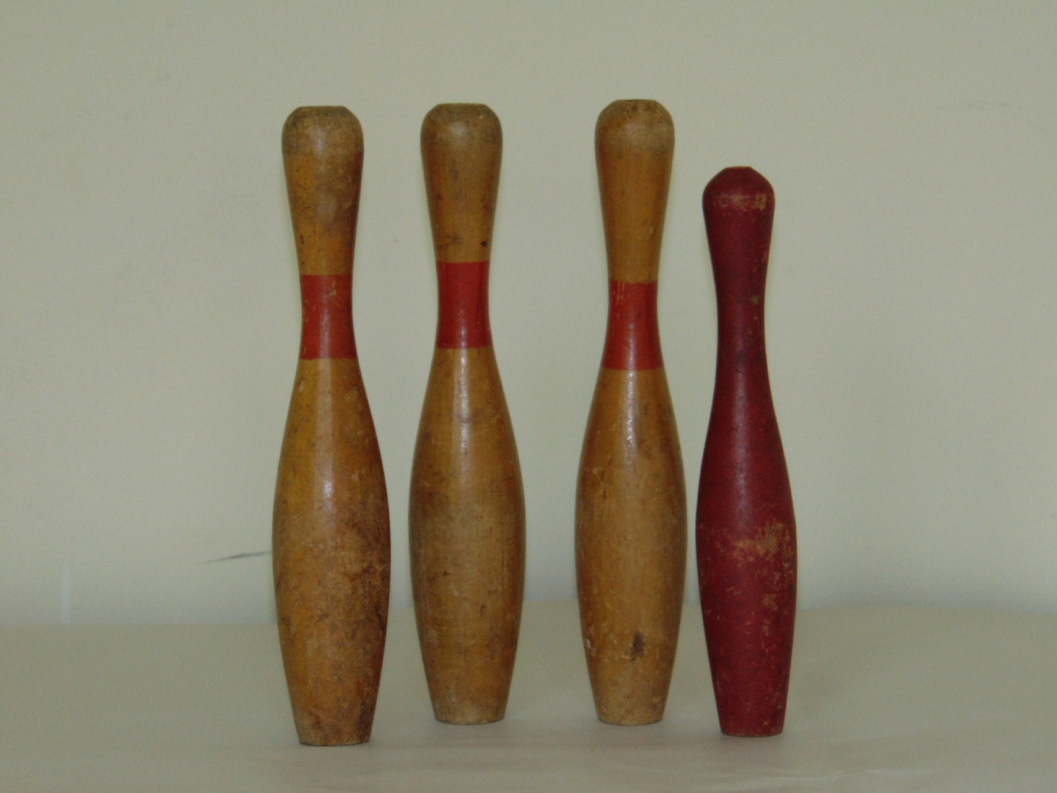 Antique miniature wood bowling pins.