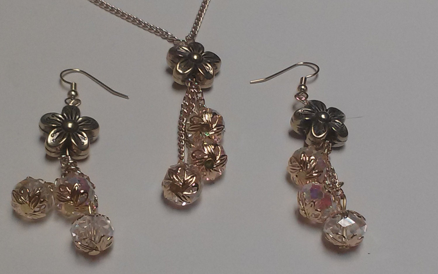 A set of matching earrings and necklace made of clear AB