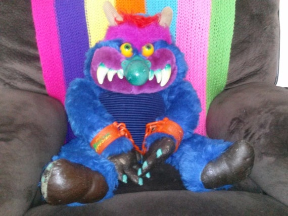 80s toy monster with handcuffs