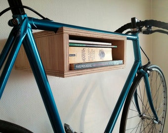 Basic wooden bike rack. Small bike storage cabinet. Wall mounted bike display bookshelf combination. Plywood.