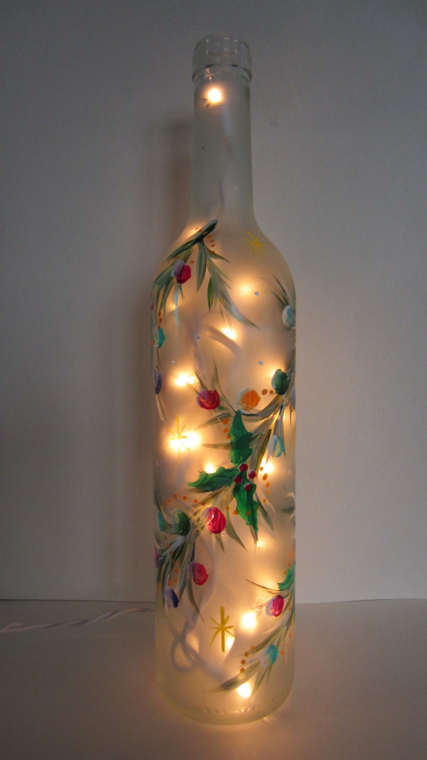 decorative garland covering a frosted lighted bottle decorative garland covering a frosted lighted bottle