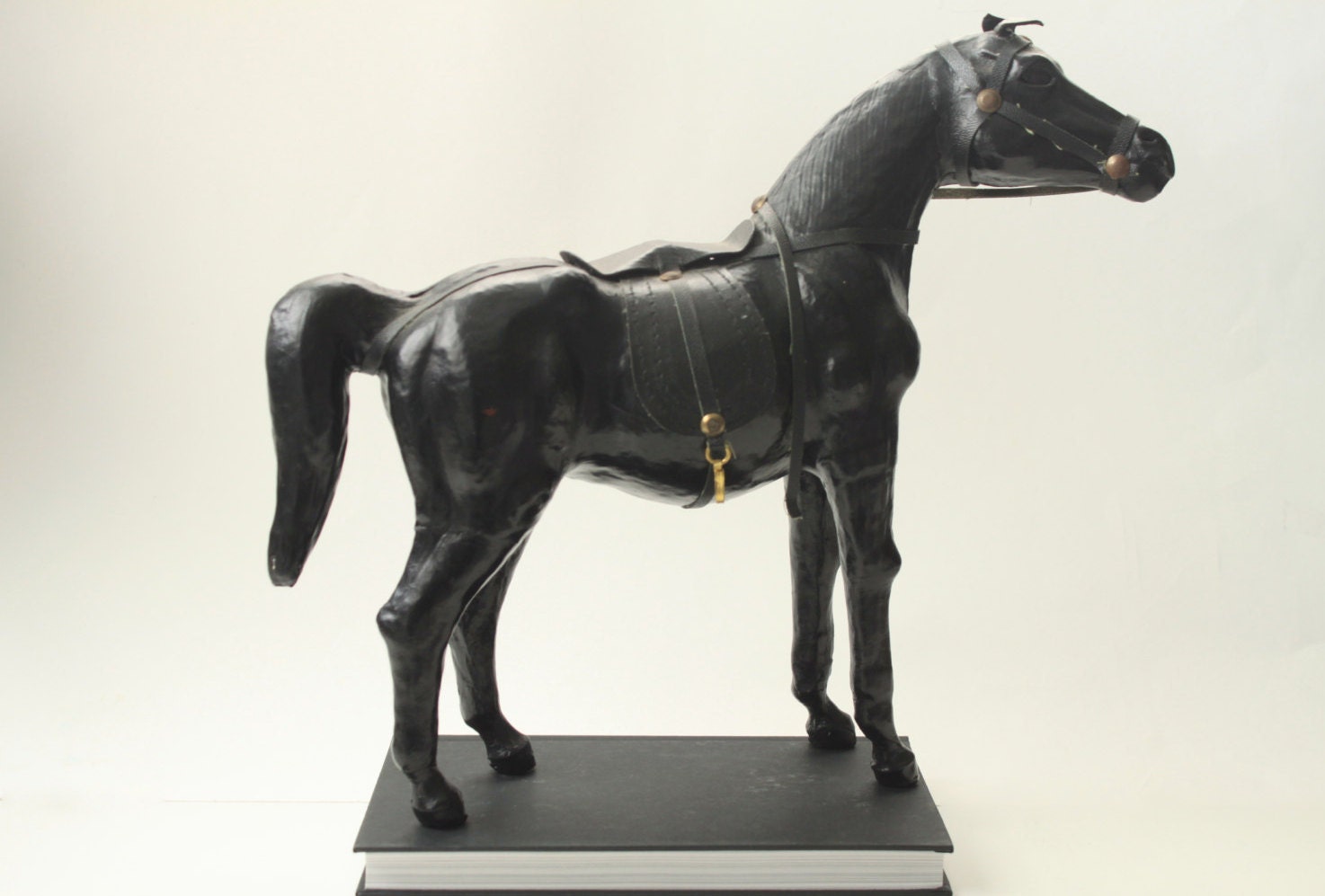 antique leather horse figurine