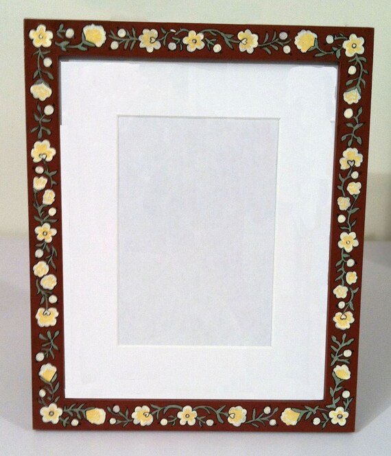 Hand painted frame with floral border includes matte