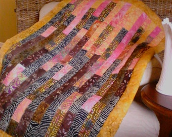 Boho style modern gold/pink/brown batik lap quilt